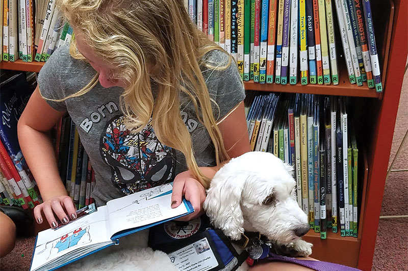 Children read to furry friends